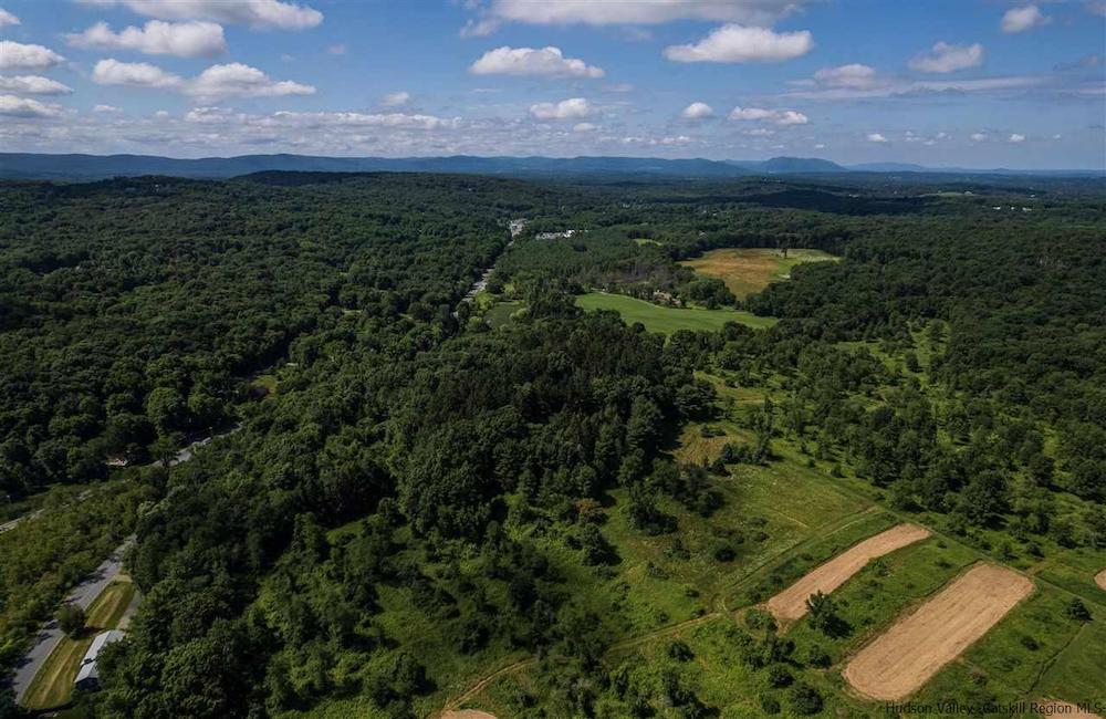 aerial view of land, mountains and sky