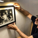 chef hanging a picture of importance