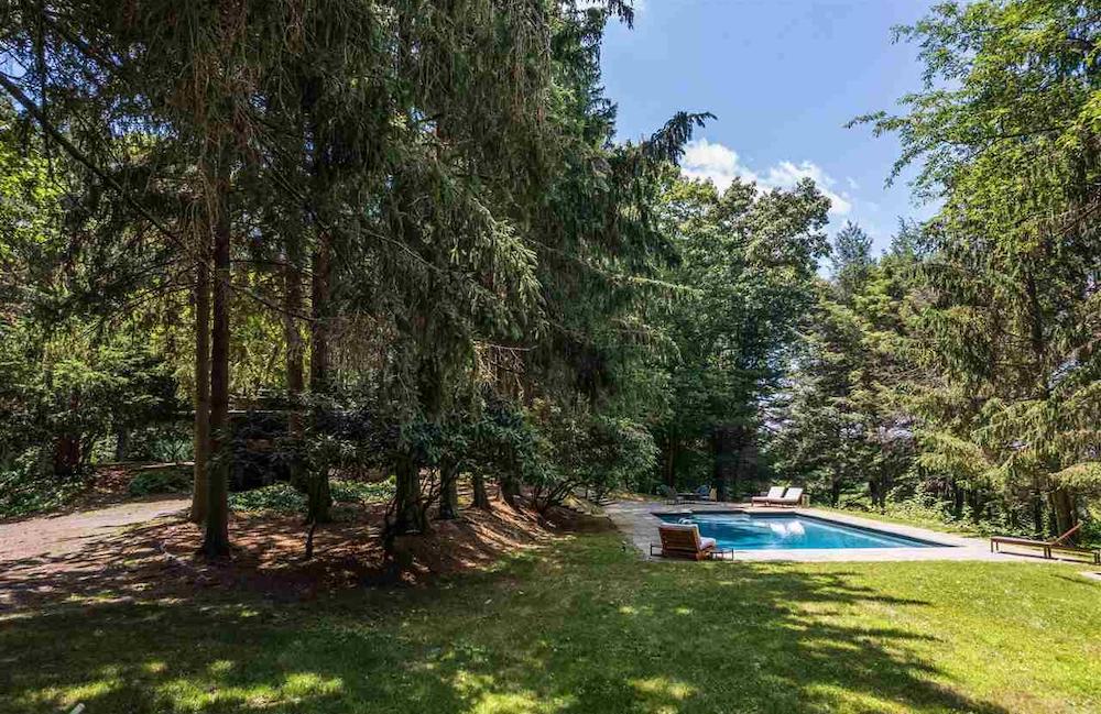 a pool with lounge chairs