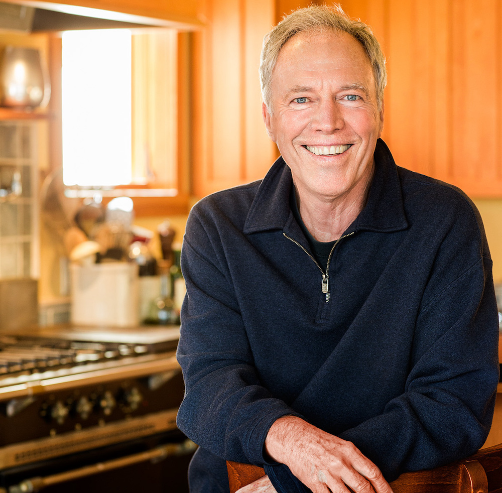 Chef Richard Erickson posing in his kitchen with a smile