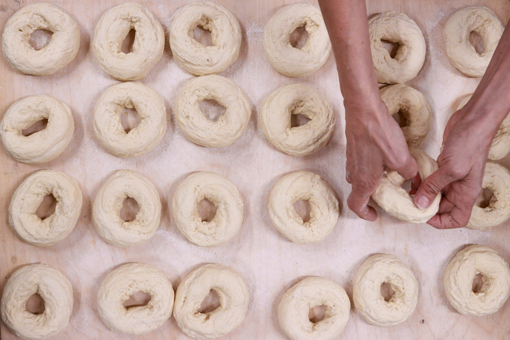 Beth George's hands shaping bagels at Bagel-ish in Beacon, NY.