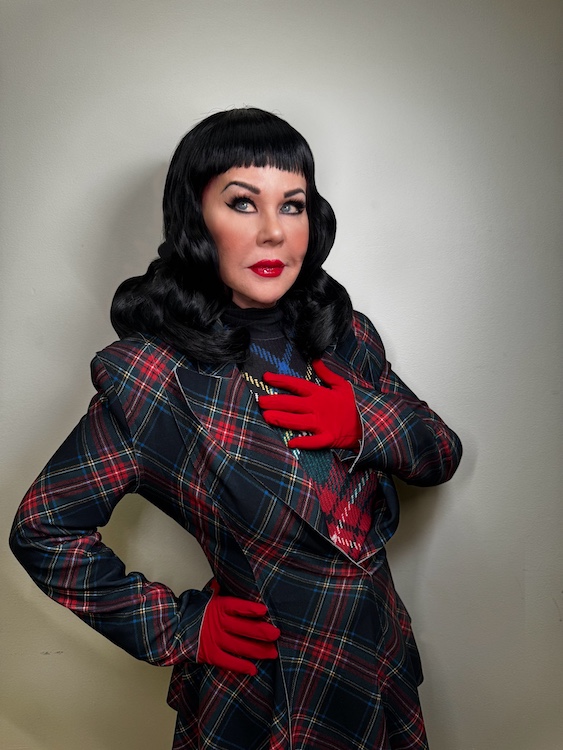 Kate Pierson posing with dark colored hair for new sone "Evil Love"