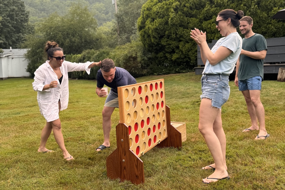 folks playing an oversized tic-tac-toe game on the lawn at Graham & Co Hotel in Phoenicia NY