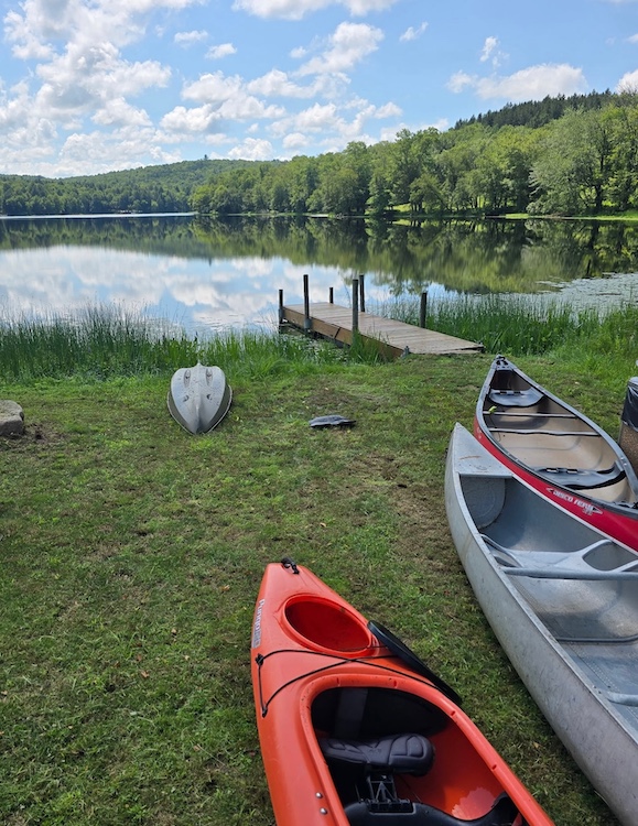 kayaks at the boat doc and lake at Kenoza Hall in Kenoza Lake NY