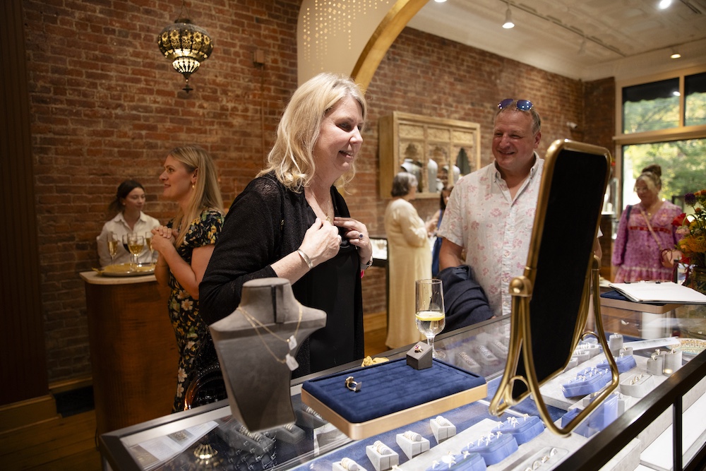customer trying on a necklace at Adel Chefridi Studio & Gallery in Rhinebeck NY