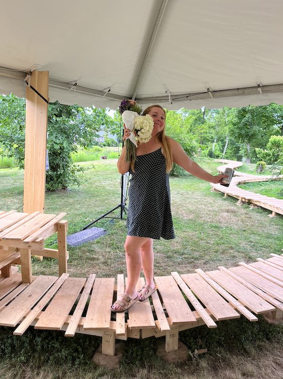 Sarah Reny posing on stage of Catskill Mountain Shakespeare in Tannersville NY