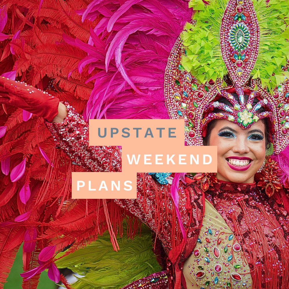 Woman in Caribbean V=Carnival costume with the "Upstate Weekend Plans" text written across the Hudson Valley, NY photo.
