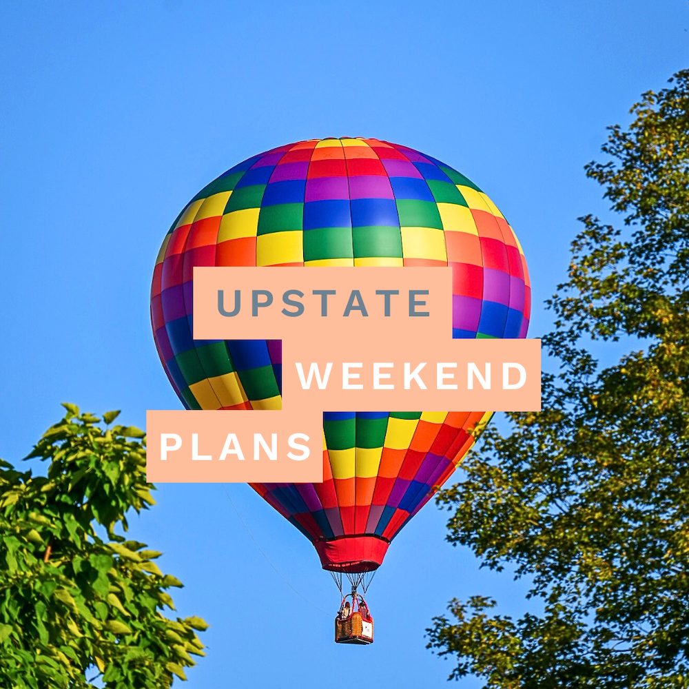Hot air balloon in the sky with the "Upstate Weekend Plans" text written across the Hudson Valley, NY photo.