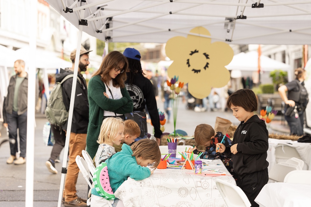 kids coloring at StockadeFaire 2025 in Uptown Kingston NY's Historic Stockade District