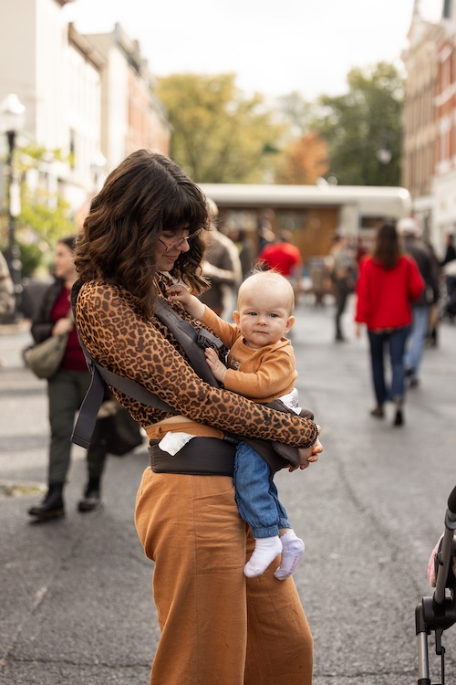 mother and baby at StockadeFaire 2025 in Uptown Kingston NY's Historic Stockade District