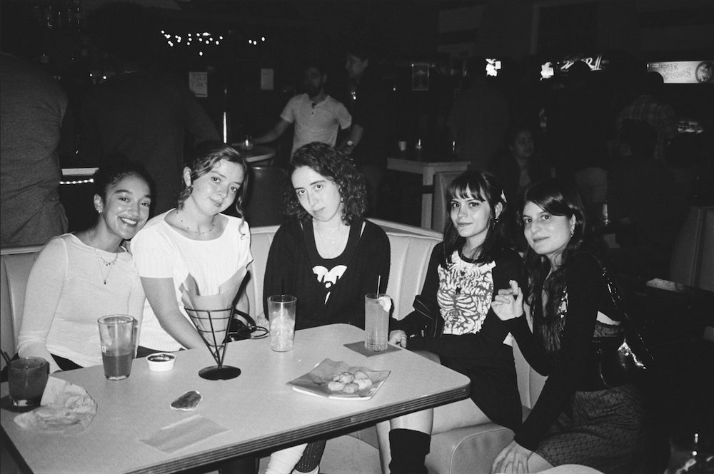 Poet Robyn Hager  with friends at a restaurant or bar