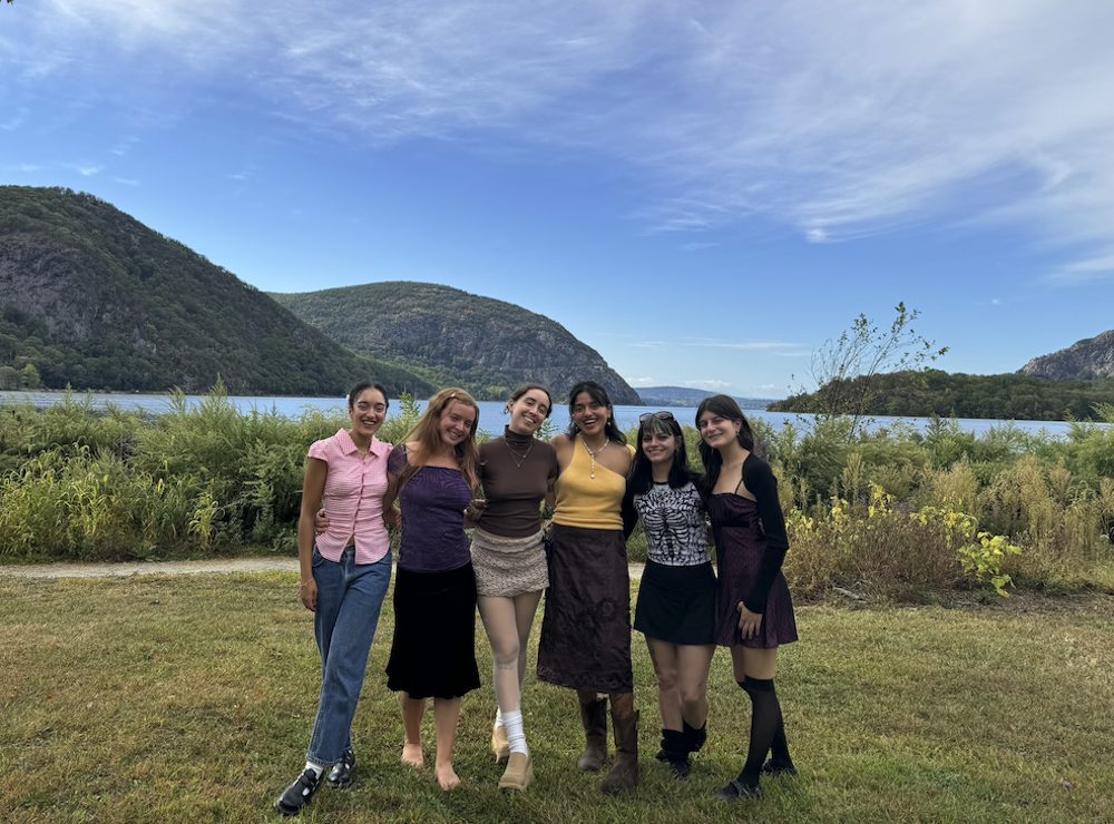 Poet Robyn Hager  with friends outside by the river