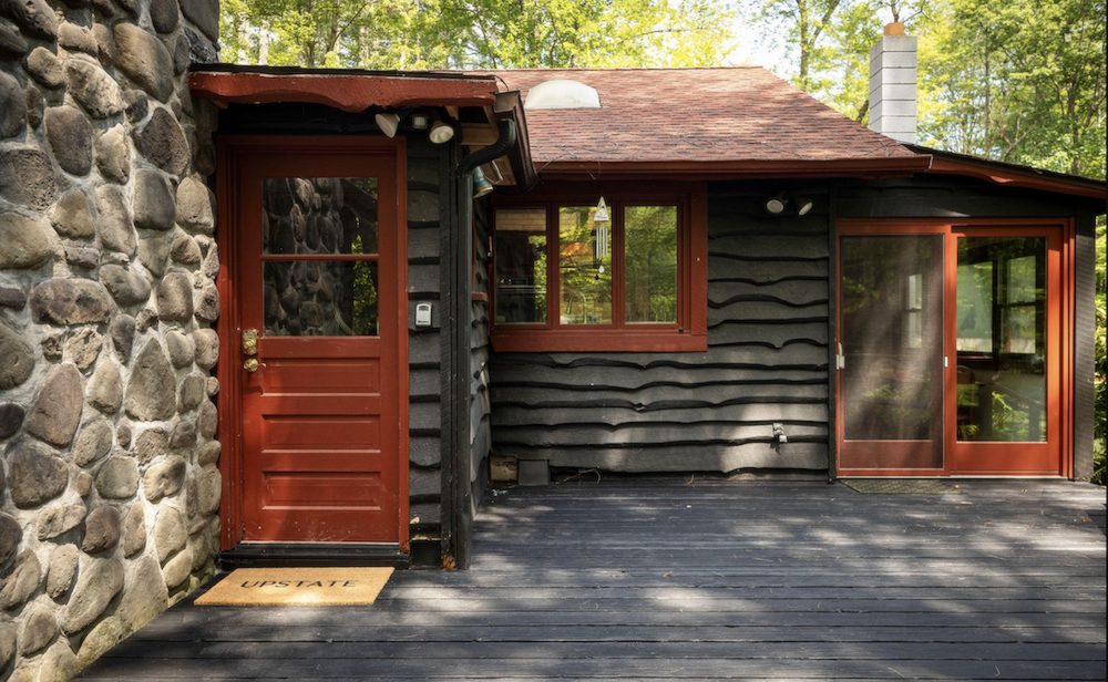 Kate Pierson puts her Woodstock NY Cabin on the market