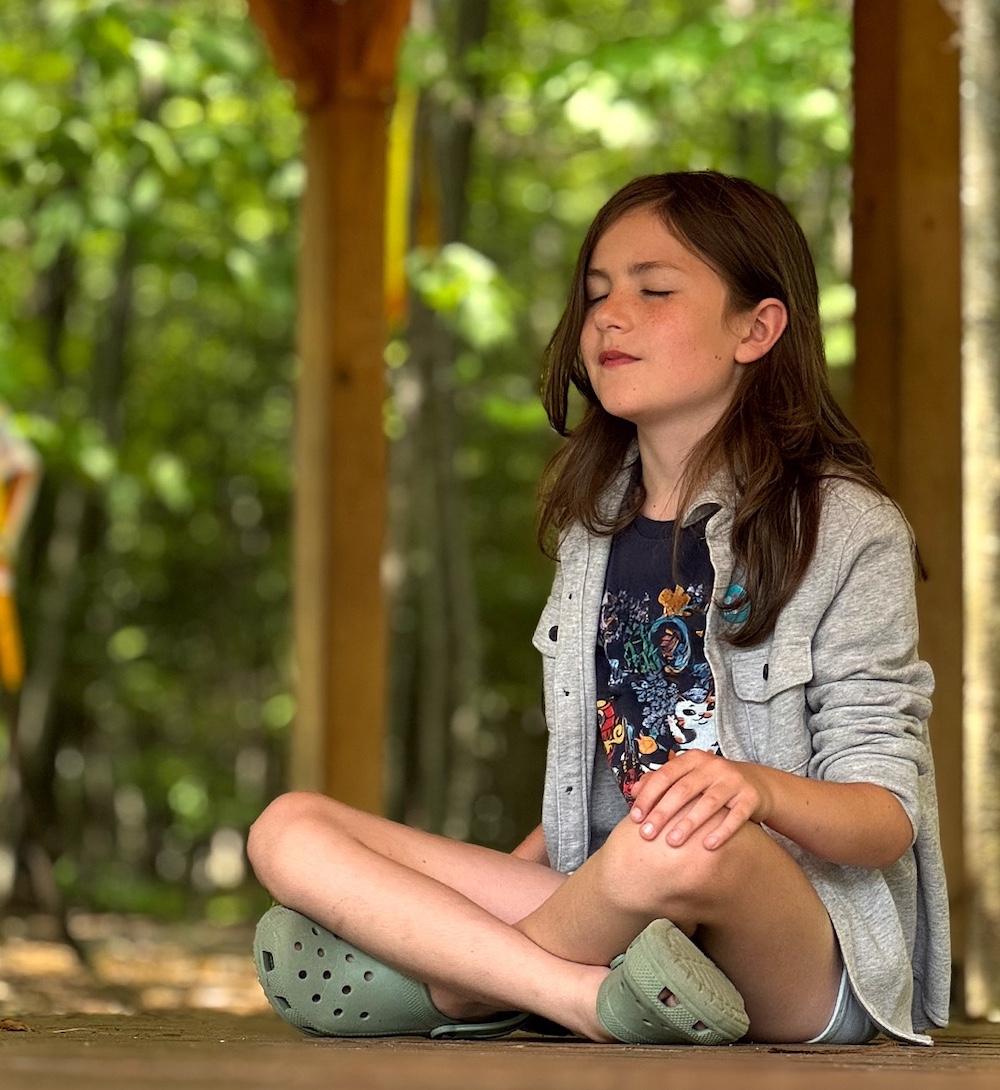 a child meditating at Middle Way School in Saugerties, NY