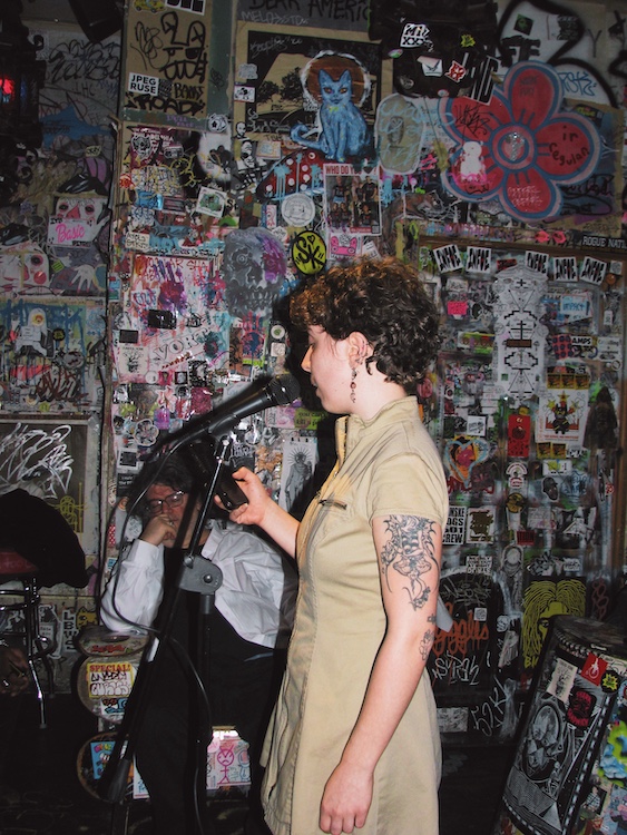 Poet Robyn Hager  at a poetry open mic