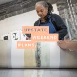artist in printmaking studio at Woodstock School of Art in Woodstock NY with the "Upstate Weekend Plans" text written across the Hudson Valley, NY photo.