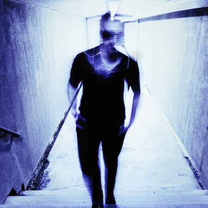 Blue blurry picture of musician Dylan Doyle