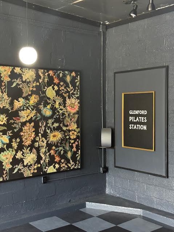 indoor sign and painting at Woodstock Infusions + Pilates in Glenford NY
