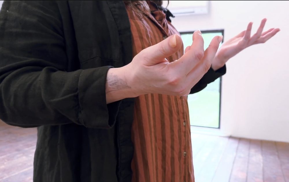Sculptor Nicki Green talking with her hands, Kingston, NY.