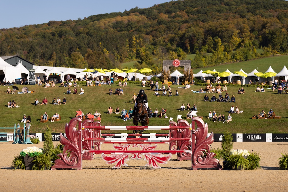 a horse jumping head on in the arena a the show at Silo Ridge Masters CSI3 Grand Prix at The Highlands Stud Farm in Amenia NY
