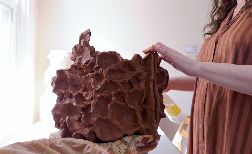 Artist Nicki Green in her studio creating sculpture