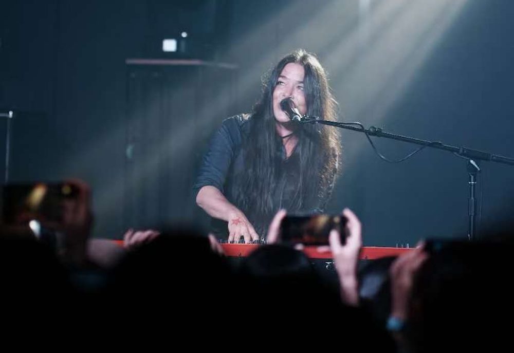 Rachael Yamagata on a piano on stage