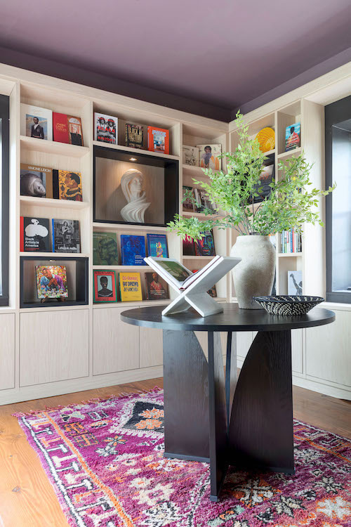 Library shelves and center table in the 2025 Kingston Design House. Designed by AphroChic designers Bryan Mason and Jeanine Hayes.