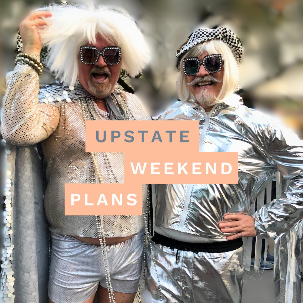 Chris Wells and Robert Lucy dressed for Halloween on The Green in Woodstock NYwith the "Upstate Weekend Plans" text written across the Hudson Valley, NY photo.