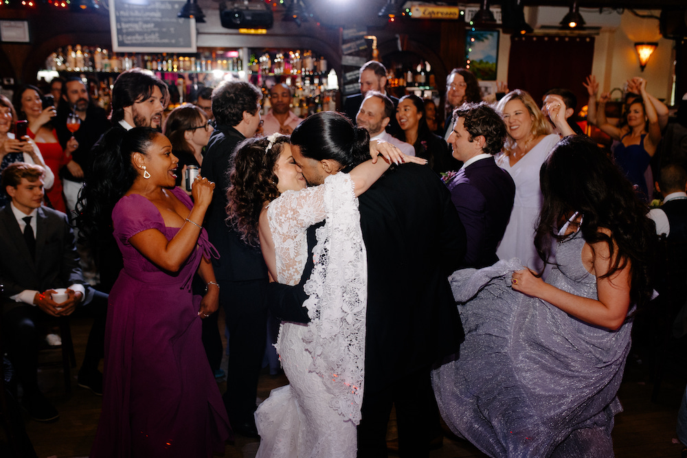 Sarah Seeds and Michael Pizzano share a kiss at their Colony Wedding in Woodstock, NY. 