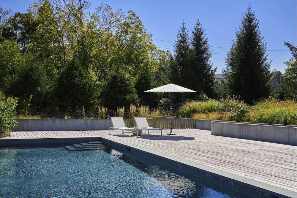 poolside chairds and umbrella at 44 Main Street, Germantown NY