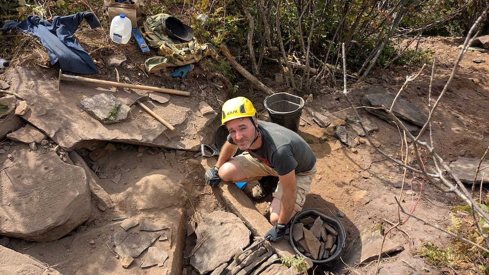 Paul Willis working on a hiking trail up on the side of a mountain in the Catskills NY
