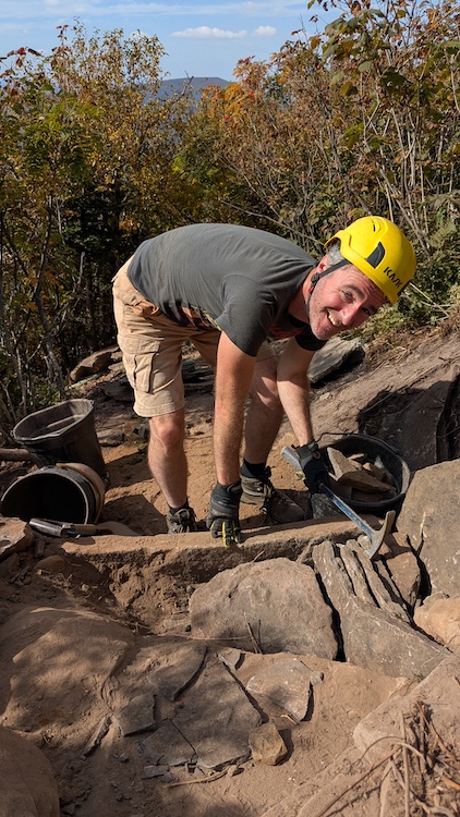 Paul Willis working on a hiking trail up on the side of a mountain in the Catskills NY