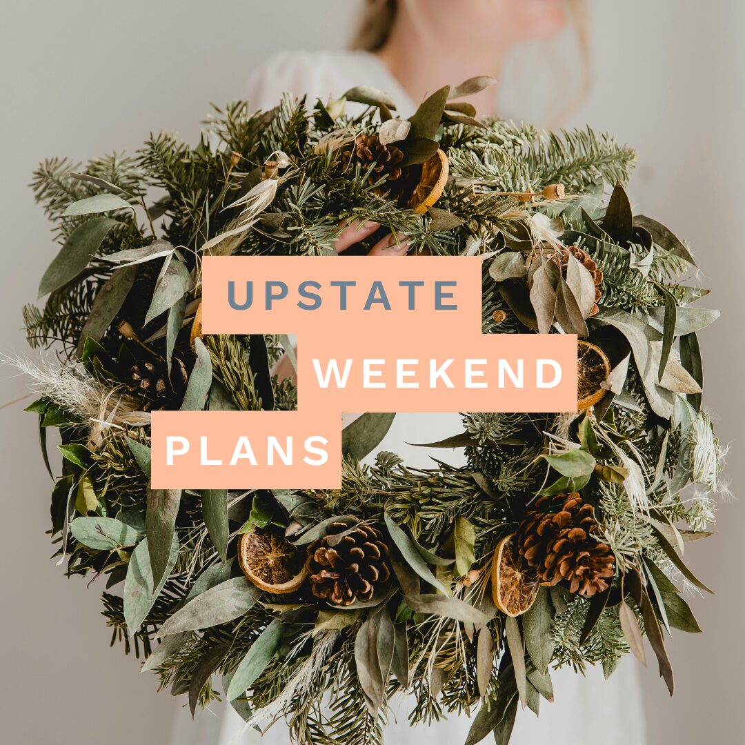 woman holding a wreath with the "Upstate Weekend Plans" text written across the Hudson Valley, NY photo.