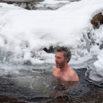 Paul Willis plunging in the ice cold water at Peter's Kill in the Minnewaska State Park Preserve, NY