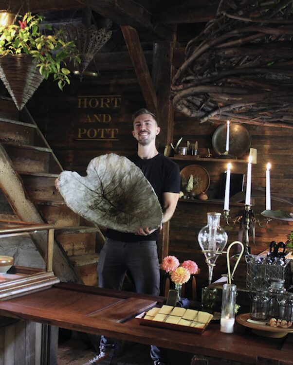 Carter Harrington holding his large leaf at Hort & Pott in Freehold NY