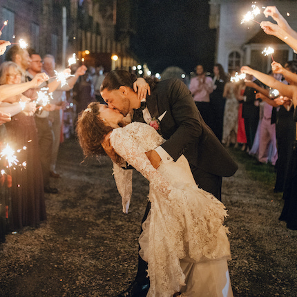A couple kissing at wedding at Colony Woodstock