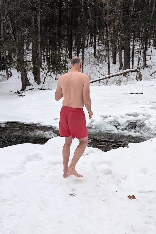 David walking in the snow for a Polar Bear Plunge into Peter's Kill in the Minnewaska State Park Preserve, NY