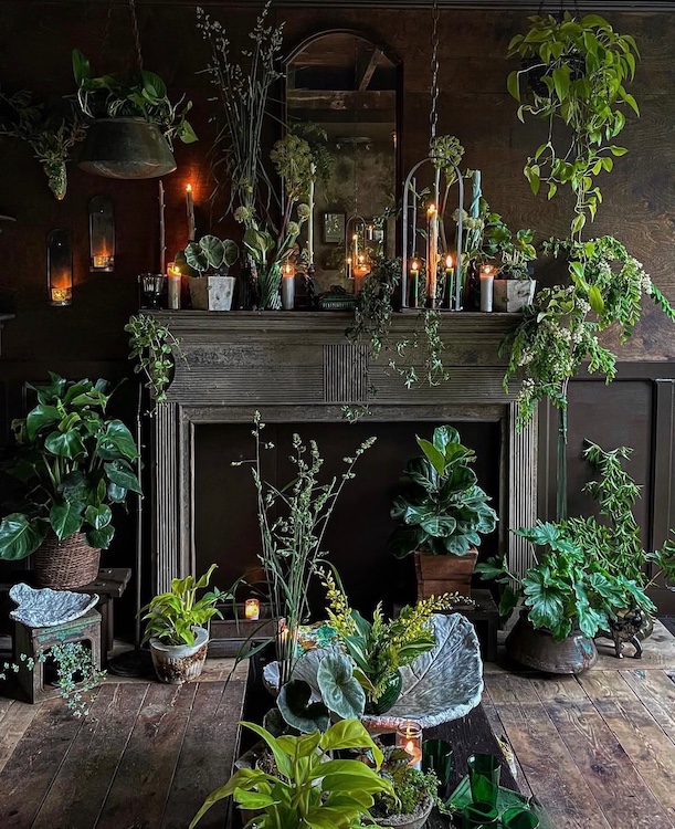 greenery and candles surrounding a fireplace at Hort & Pott in Freehold NY