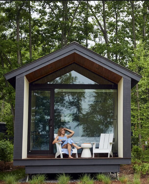 woman on the porch of cabin hut at Hutton Brickyard in Kingston NY