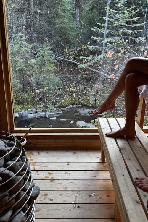 legs and coals inside a sauna