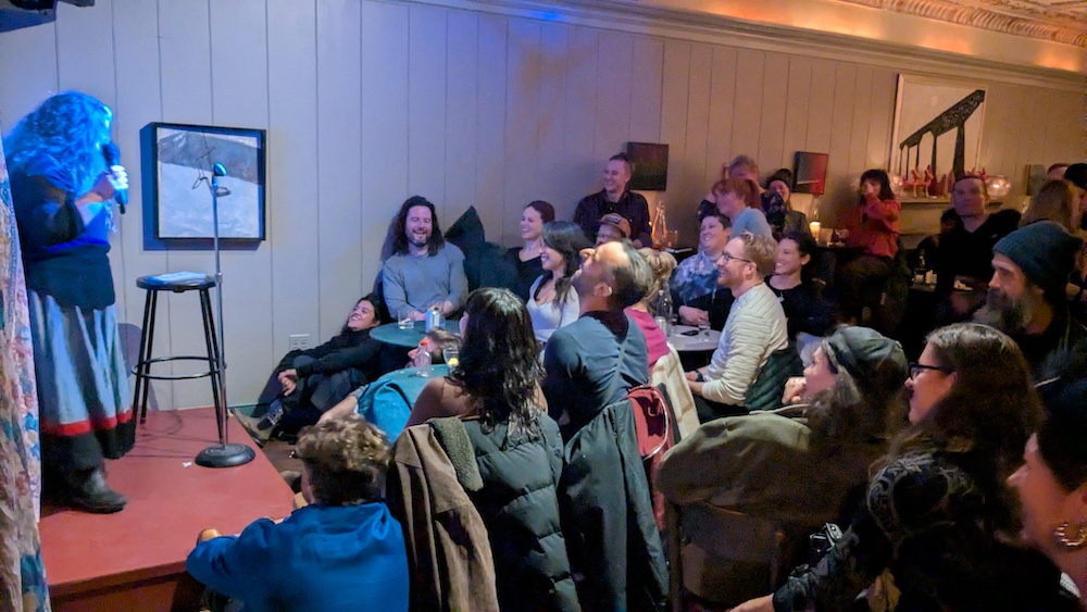 crowd laughing at a comedy show