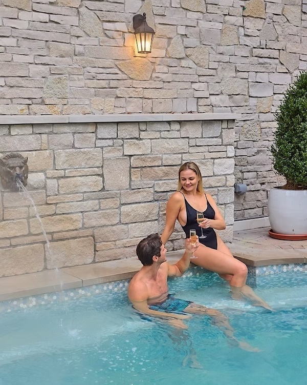 Mineral spa with a couple toasting at Mirbeau Inn + Spa in Rhinebeck NY