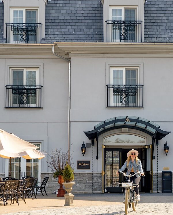 woman riding a bike at Mirbeau Inn + Spa in Rhinebeck NY