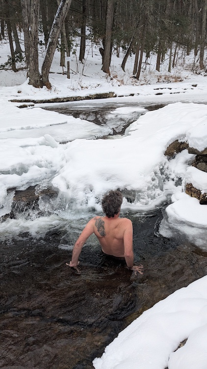 slipping into the icy waters at into Peter's Kill in the Minnewaska State Park Preserve, NY