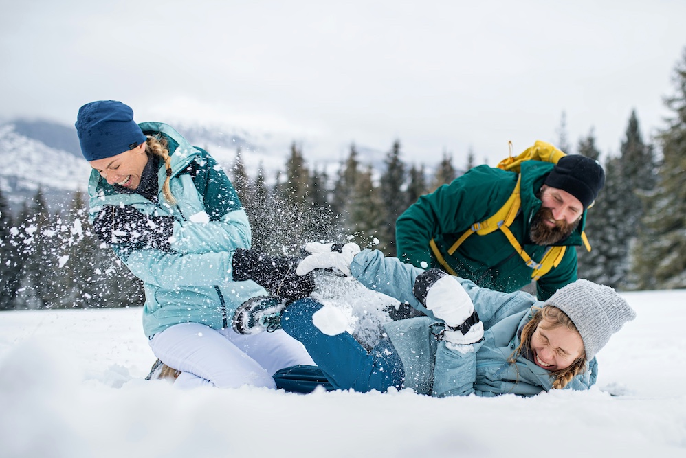 people having a snow fight for fun