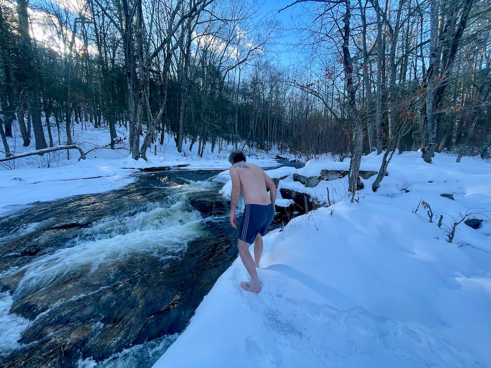 Paul Willis is walking in the snow for a Polar Bear Plunge into Peter's Kill in the Minnewaska State Park Preserve, NY