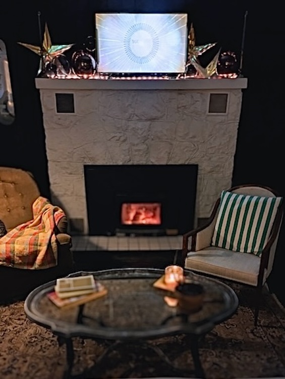 Living room with fireplace aglow