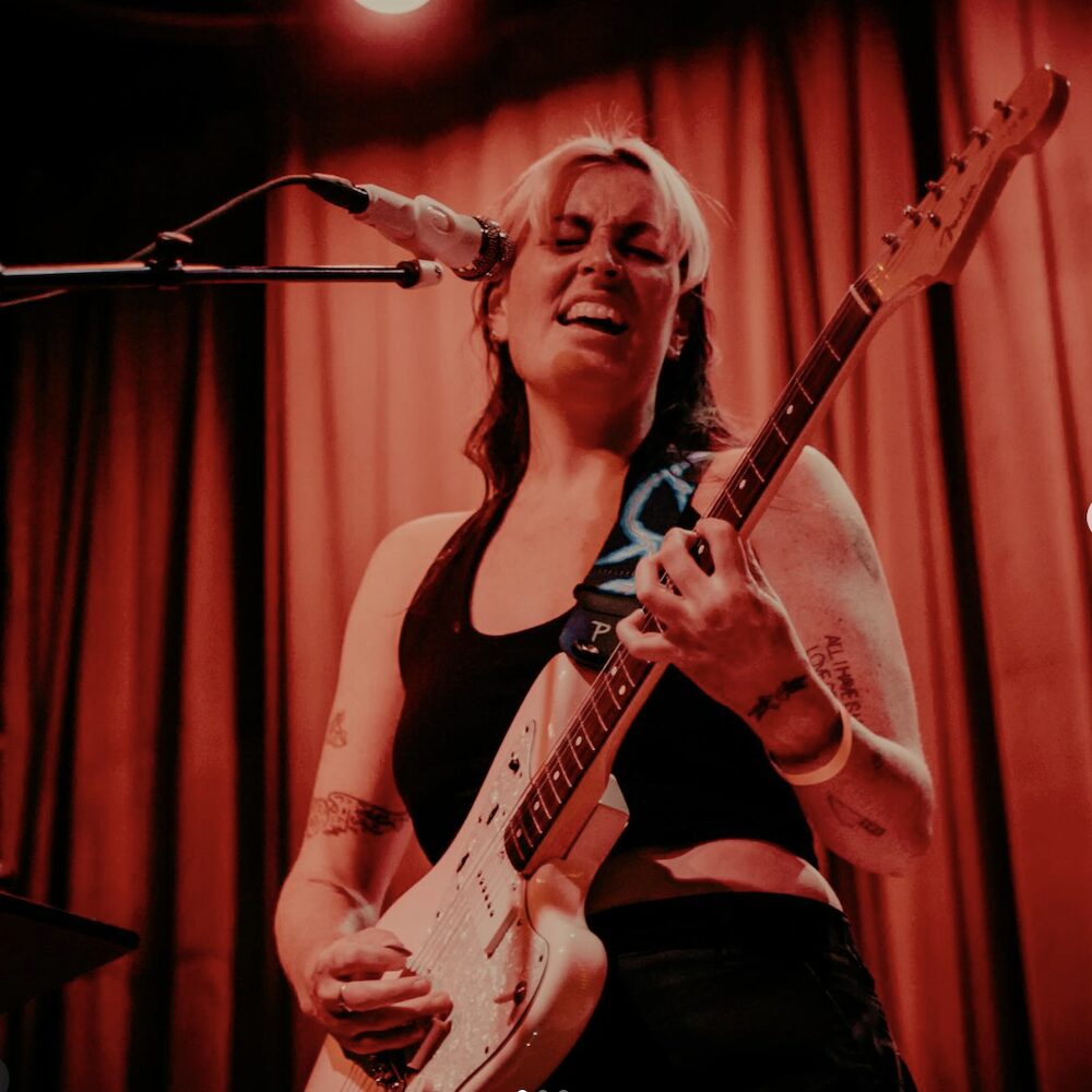 Hudson Valley musician Aubrey Haddard performing on stage