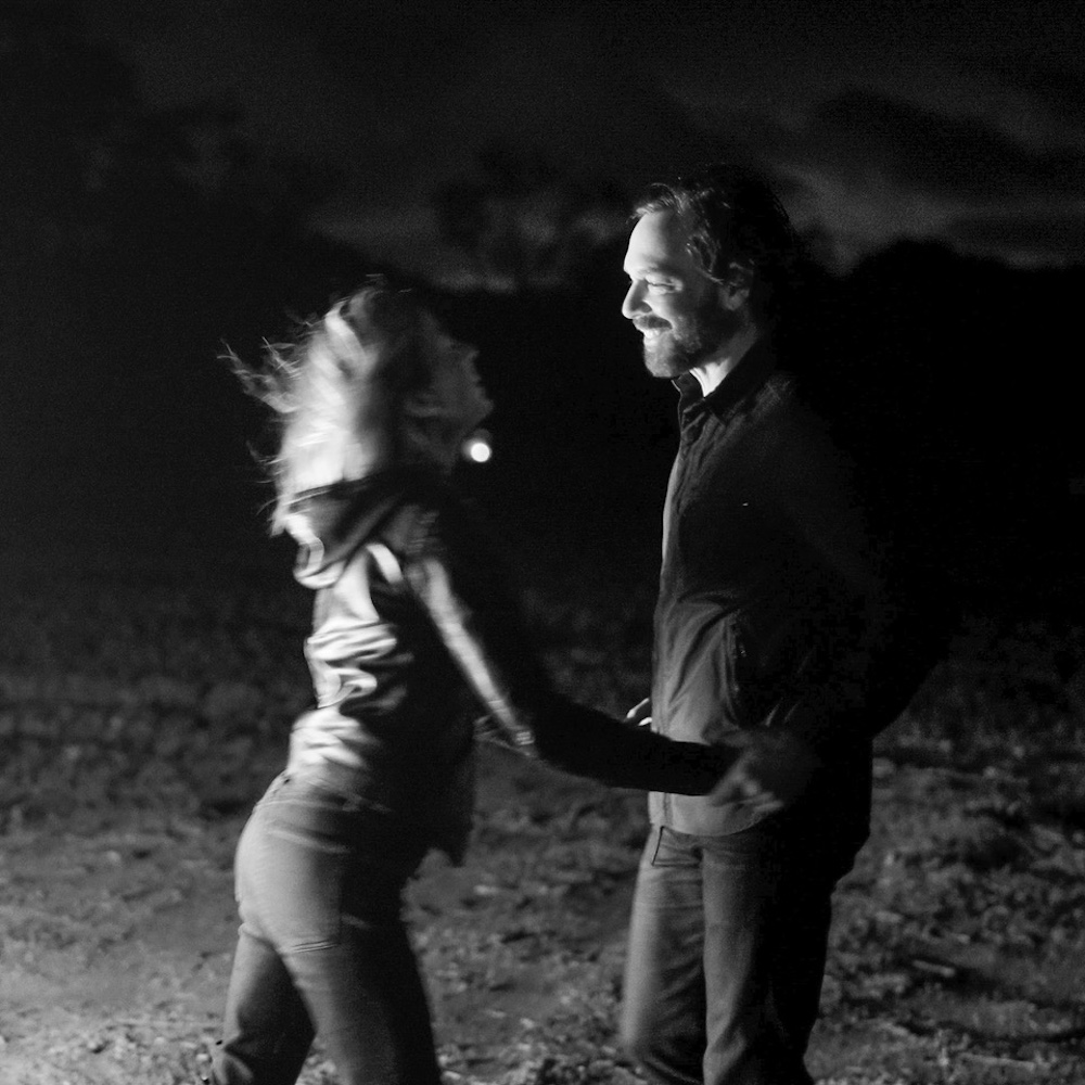 Matt Pond PA and Anya Marina at night near a bonfire