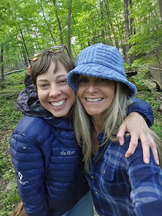 Courtney Beaupre and Herbal Woodstock Co-founder Melissa Gibson hiking in the woods near Woodstock, NY.